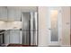 Kitchen featuring stainless steel refrigerator and white cabinets at 13608 N 19Th Pl, Phoenix, AZ 85022