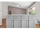 Kitchen island with white countertop and decorative cabinets at 13608 N 19Th Pl, Phoenix, AZ 85022