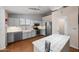 Updated kitchen featuring stainless steel appliances, a farmhouse sink, and tile backsplash at 13608 N 19Th Pl, Phoenix, AZ 85022