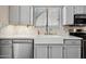 Bright kitchen area featuring modern appliances, ample counter space, and natural lighting at 13608 N 19Th Pl, Phoenix, AZ 85022