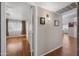Bright, open living room with wood floors and natural light from large windows at 13608 N 19Th Pl, Phoenix, AZ 85022