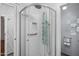 Modern shower with glass enclosure and updated fixtures, plus a convenient grab bar at 13608 N 19Th Pl, Phoenix, AZ 85022