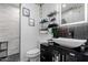 Modern bathroom featuring a sleek vanity, elegant lighting, and a walk-in shower at 14001 N 34Th Dr, Phoenix, AZ 85053
