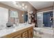 Bathroom with a shower and bath, vanity, and commode at 14001 N 34Th Dr, Phoenix, AZ 85053