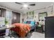Stylish bedroom with a plush bed, string lights, and eclectic decor at 14001 N 34Th Dr, Phoenix, AZ 85053