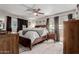 A bright bedroom featuring a large bed and matching furniture for a luxurious feel at 14001 N 34Th Dr, Phoenix, AZ 85053