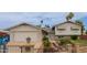 Charming front exterior showcasing well-maintained landscaping and a welcoming entrance, attached garage and desert landscaping at 14001 N 34Th Dr, Phoenix, AZ 85053