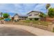 Beautiful exterior with solar panels, mature trees, a well-kept lawn, and a charming fence, perfect for Gathering enjoyment at 14001 N 34Th Dr, Phoenix, AZ 85053