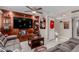 Spacious living room with a large television, ceiling fan, comfortable sofa and sports decor at 14001 N 34Th Dr, Phoenix, AZ 85053