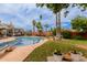 Beautiful backyard pool surrounded by lush landscaping and mature palm trees at 14001 N 34Th Dr, Phoenix, AZ 85053