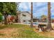 Inviting backyard with a sparkling pool, wooden deck, and beautiful palm trees at 14001 N 34Th Dr, Phoenix, AZ 85053