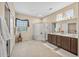 Spacious bathroom with a glass enclosed shower, dual sinks and neutral colors that makes this space feel bright and clean at 15753 W Kino Dr, Surprise, AZ 85374