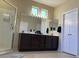 Another view of the bright bathroom showcasing a glass-enclosed shower and double vanity at 15753 W Kino Dr, Surprise, AZ 85374