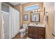 Cozy bathroom with a walk-in shower, single sink vanity, and warm neutral tones that create a relaxing retreat at 15753 W Kino Dr, Surprise, AZ 85374