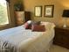 Inviting bedroom with a queen bed, dresser, and nightstands at 15753 W Kino Dr, Surprise, AZ 85374