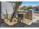 Private courtyard features desert landscaping and offers a cozy outdoor dining or relaxing space at 15753 W Kino Dr, Surprise, AZ 85374