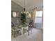 Bright dining area featuring a glass table, chairs, and decorative chandelier at 15753 W Kino Dr, Surprise, AZ 85374