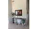 Elegant entryway featuring decorative table with plants and artwork, showcasing stylish design at 15753 W Kino Dr, Surprise, AZ 85374