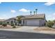 Charming single-story home with well-manicured landscaping and a convenient two-car garage at 15753 W Kino Dr, Surprise, AZ 85374