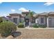 Well-maintained home with desert landscaping, a tile roof, and a welcoming entrance at 15753 W Kino Dr, Surprise, AZ 85374