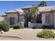 Charming single-story home with desert landscaping and a well-maintained front yard at 15753 W Kino Dr, Surprise, AZ 85374