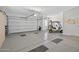 Spacious two car garage with a golf cart and neutral paint at 15753 W Kino Dr, Surprise, AZ 85374