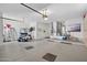 Spacious two car garage with a golf cart, ladder, and neutral paint at 15753 W Kino Dr, Surprise, AZ 85374