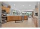 Spacious kitchen seamlessly blends into the living area for a modern design at 15753 W Kino Dr, Surprise, AZ 85374