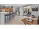Open-concept kitchen with a peninsula bar and seamless access to the patio at 15753 W Kino Dr, Surprise, AZ 85374