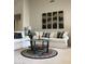 Cozy living room setup with elegant sofas, a glass coffee table, and contemporary artwork at 15753 W Kino Dr, Surprise, AZ 85374