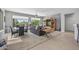 Open-concept living room with a view of the lush outdoor landscaping at 15753 W Kino Dr, Surprise, AZ 85374