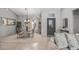 Open living space with dining area, tile floors, plenty of natural light, and stylish furnishings at 15753 W Kino Dr, Surprise, AZ 85374