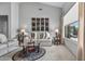 Inviting living room features modern decor, neutral tones, and a large window with backyard views at 15753 W Kino Dr, Surprise, AZ 85374