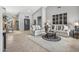 Spacious living room showcasing neutral furniture, tile flooring, and high ceilings at 15753 W Kino Dr, Surprise, AZ 85374