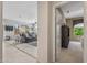 Bright living room features a comfortable sofa, modern decor, and a large window with a view to the outdoors at 15753 W Kino Dr, Surprise, AZ 85374
