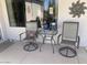 Cozy outdoor seating area with a glass table, perfect for relaxing and enjoying the weather at 15753 W Kino Dr, Surprise, AZ 85374