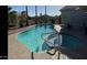 A private pool with a spa offers a relaxing retreat in the backyard at 15753 W Kino Dr, Surprise, AZ 85374