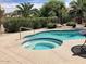 Backyard pool and spa surrounded by desert landscaping at 15753 W Kino Dr, Surprise, AZ 85374