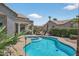 Enjoy the sparkling pool and spa area in this beautifully landscaped backyard at 15753 W Kino Dr, Surprise, AZ 85374