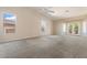 Large bedroom with ample space, neutral carpet, and natural light coming through the windows at 15989 W Indianola Ave, Goodyear, AZ 85395