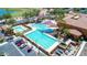 Stunning community pool area featuring multiple pools, seating, and shade structures for residents to enjoy at 15989 W Indianola Ave, Goodyear, AZ 85395
