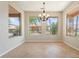 Bright dining area with backyard views through picture windows, offering an ideal space for Gathering meals and entertaining at 15989 W Indianola Ave, Goodyear, AZ 85395