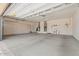 Spacious garage with lots of storage cabinets and a sink for convenience and storage at 15989 W Indianola Ave, Goodyear, AZ 85395