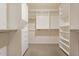 Organized walk-in closet with shelving and hanging racks for optimal storage at 15989 W Indianola Ave, Goodyear, AZ 85395