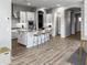 Well-equipped kitchen features a large island, modern appliances, and ample storage space at 16006 W Electra Ln, Surprise, AZ 85387
