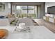 Comfortable living area with sliding glass doors to the backyard and a view of outdoor seating at 16006 W Electra Ln, Surprise, AZ 85387
