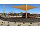 Community playground featuring various climbing structures and slides at 16006 W Electra Ln, Surprise, AZ 85387