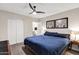 Comfortable bedroom with a view of a bathroom, ceiling fan, and large closet at 1639 W Indianola Ave, Phoenix, AZ 85015