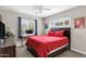 Cozy bedroom with a comfortable bed, a ceiling fan, and a window at 1639 W Indianola Ave, Phoenix, AZ 85015