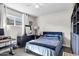 This charming bedroom features a ceiling fan, comfortable bed, and a modern dresser with a mirror at 1639 W Indianola Ave, Phoenix, AZ 85015